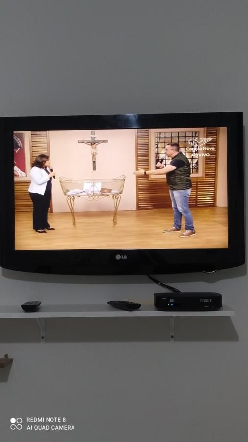 Quarto com tv,ar,frigobar,wifi e garagem Aparecida  Esterno foto